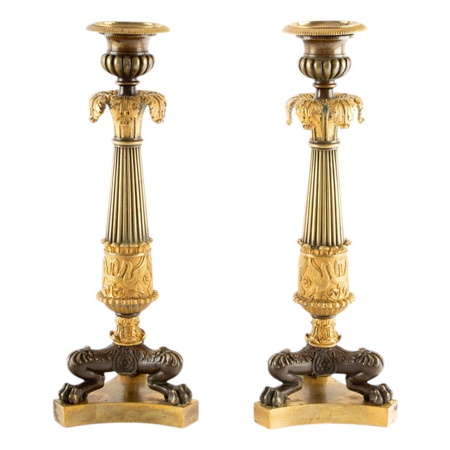 Guardians of the Flame: Pair of Early 19th C Gilt Bronze French Candlesticks For Sale