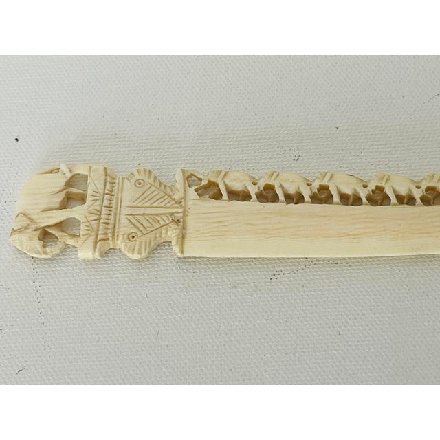 Victorian era handcarved bronze ne letter opener with elephant figurines .