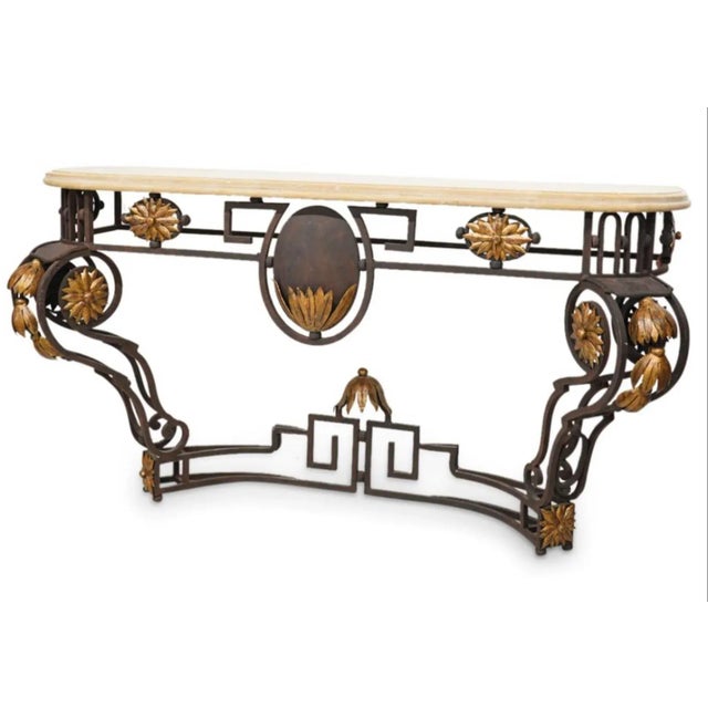 This console table makes a dramatic statement! It is a late 20th century iron console table with a stone top. The top...
