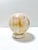 An exceptionally substantial vintage banded onyx sphere weighing nearly 12 pounds, with dramatic natural layers of ivory,...