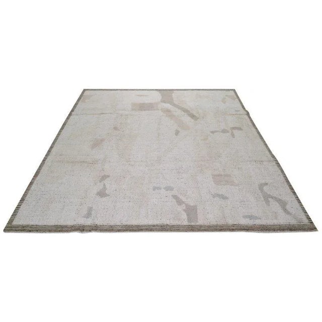 Moroccan Azilal hand knotted wool rug with abstract design.