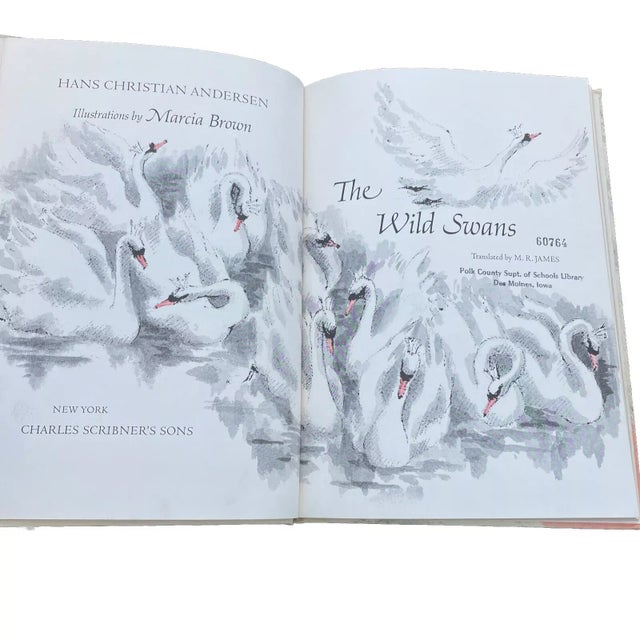 Experience the magic of Hans Christian Andersen's The Wild Swans with this vintage children's book. Published in 1967 by...