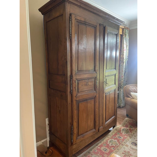 Substantial French Provincial oak armoire in the Normandy tradition, sourced and sold by Baltimore’s renowned Gaines...