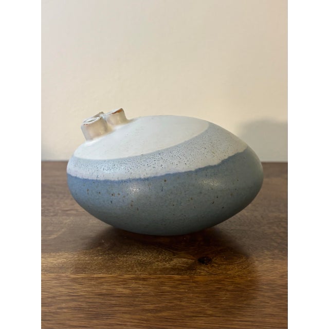 A beautifully restrained mid century American studio pottery weed pot by Isabel Parks, showcasing an elegant organic form...