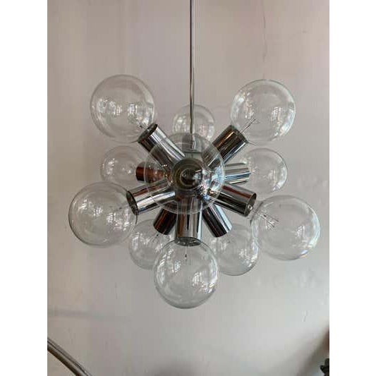Kalmar Atomic Aluminum Chandelier. Round lightbulbs make the fixture anything you want it to be! white, clear or even...