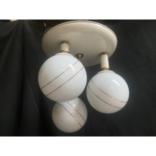 Ceiling lamp made of metal and glass, 1970s Pendant lamp with 3 light points in the shape of closed balls, 1960s-1970s....
