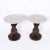 Chic mid century round marble top stands featuring conspicuous carved mahogany stylized pineapples over leaves on round...