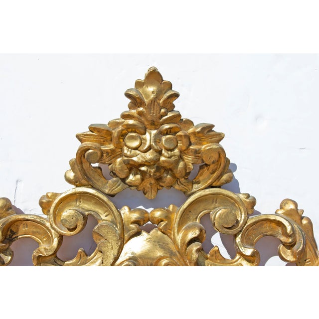 Antique Baroque style gilt mirror. Bold carvings, 19th century. Measures: 54" x 36". See our other mirrors. Presented by...