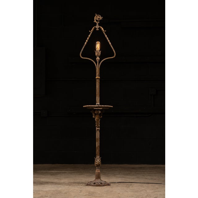 Ornate brass lamp with what appears to be the head of a crozier on top.
