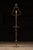 Ornate brass lamp with what appears to be the head of a crozier on top.