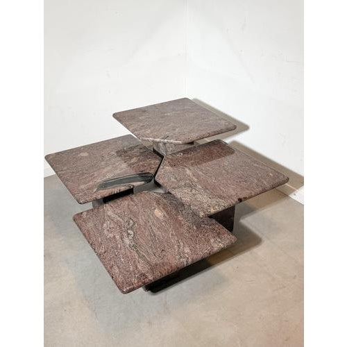 A rare and sculptural set of four granite nesting tables, designed as a modular composition. Each table features a solid...