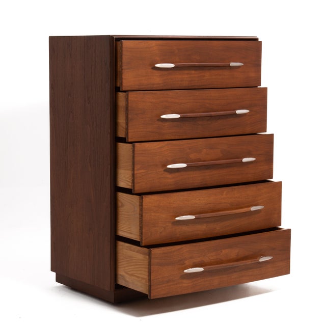 A tall five drawer walnut chest designed by T.H. Robsjohn Gibbings for Widdicomb. I offer a lot of Widdicomb pieces for...