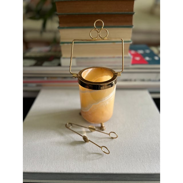 vintage translucent stone garnish server with brass-tone metal accents, raised feet, a handled frame, and coordinating...