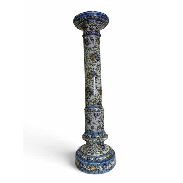 An elegant and intricately decorated vintage 20th-century Italian polychrome faience ceramic pedestal column. This stately...