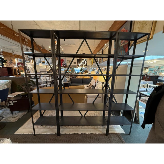 Design Plus Gallery presents a Metal Industrial Shelving Unit. The unit is freestanding with five shelves for each of the...