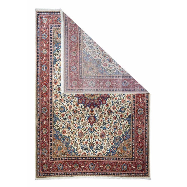 A rounded old gold sub medallion with palmette pendants is comfortably set with a red 16 point round medallion with crisp...