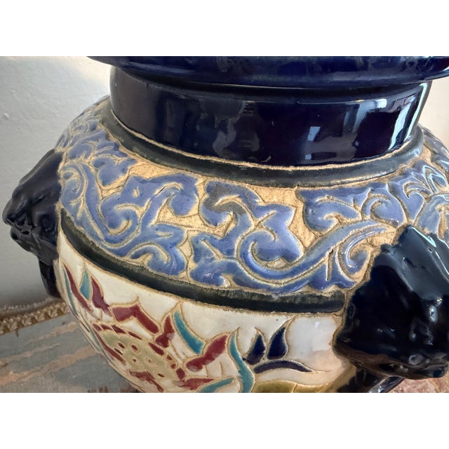 A striking vintage Asian Chinoiserie style majolica pottery temple ginger jar / covered urn. This substantial decorative...