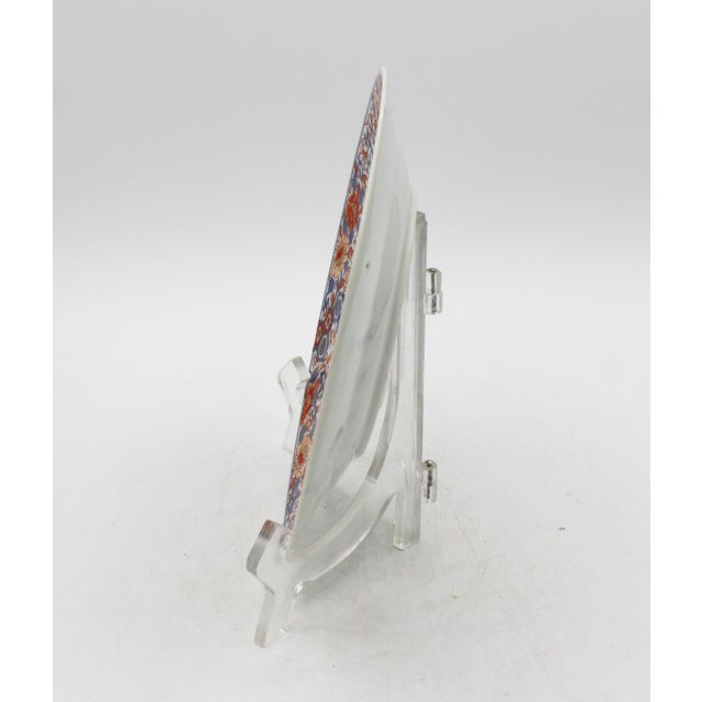 Late 19th century Meiji period Japanese Imari Plate. Extravagantly decorated with butterflies, floral and geometric motifs...