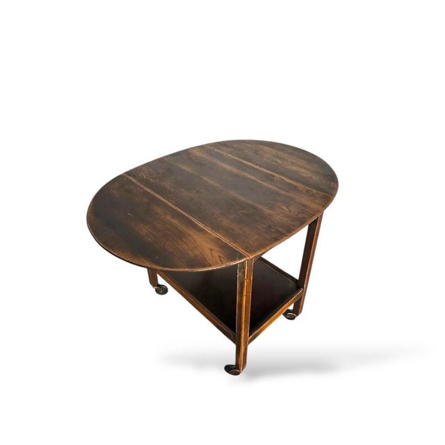 A beautifully made vintage oak folding drinks trolley with a classic oval top and elegant proportions. Designed to extend...