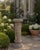 A substantial late-20th-century garden pedestal cast in concrete and modeled after a classical architectural column. The...