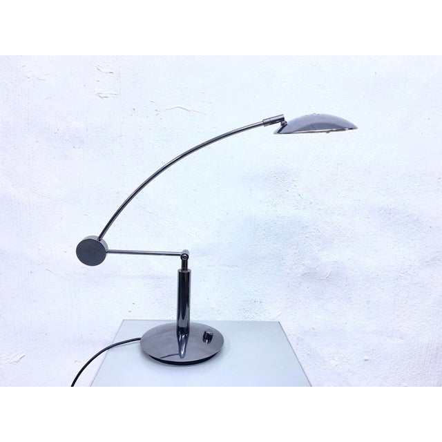 One table lamp from the 1980s, single-bulb, halogen socket by Hillebrand. Dark gray metallic painted metal. Good used...