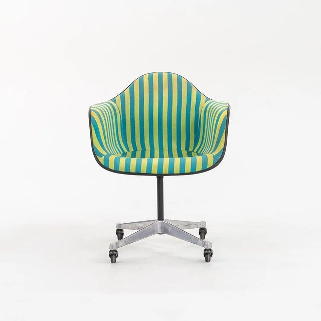 This is a rare and exceptional set of eight original 1967 Herman Miller Eames PACC (Pivoting Arm Chair with Casters)...