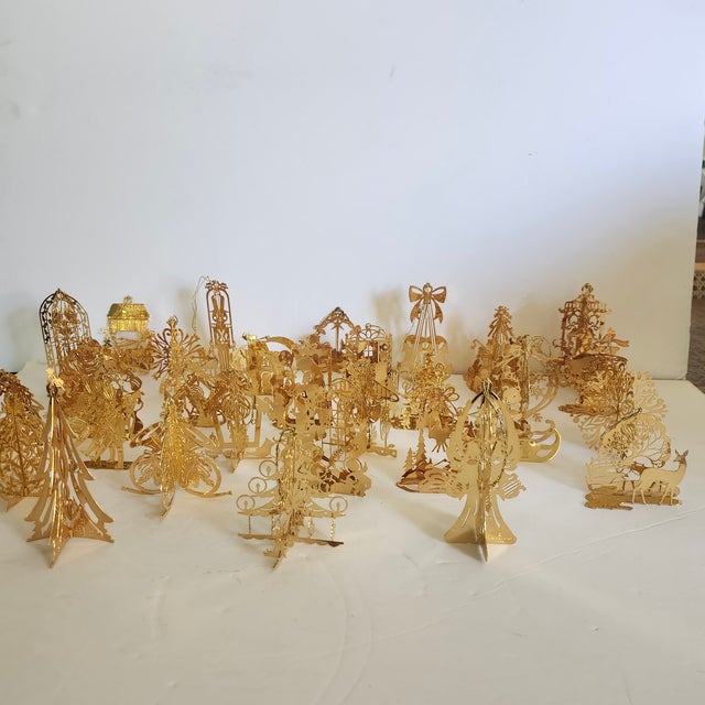 The Danbury Mint 1984, 1985, 1991 23K Gold Bathed Christmas Ornaments Collection includes 31 pieces of intricate style...