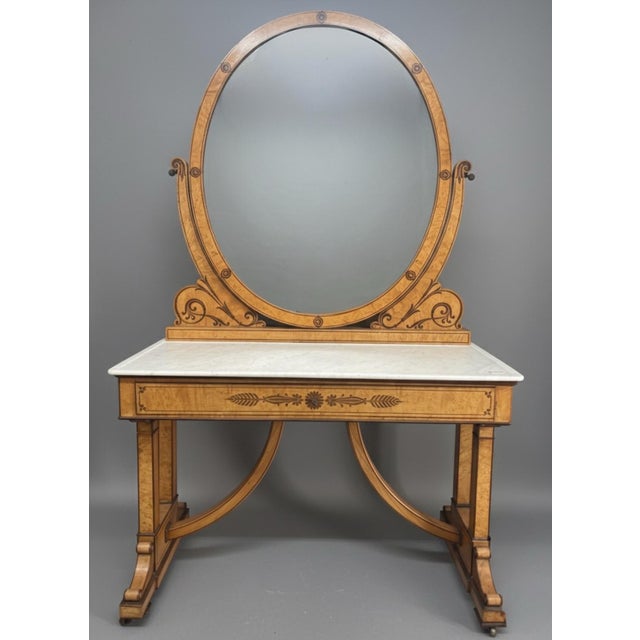 This exquisite 19th-century dressing table (or coiffeuse) is a masterclass in elegant proportion and fine woodworking....
