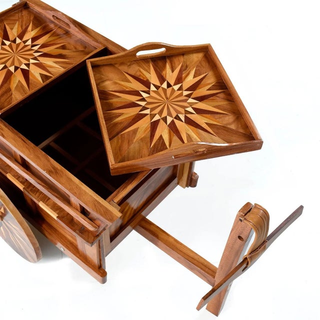 This handcrafted, solid wood bar deviates from our usual stable, but we couldn't resist it's charm! The bar cart is...