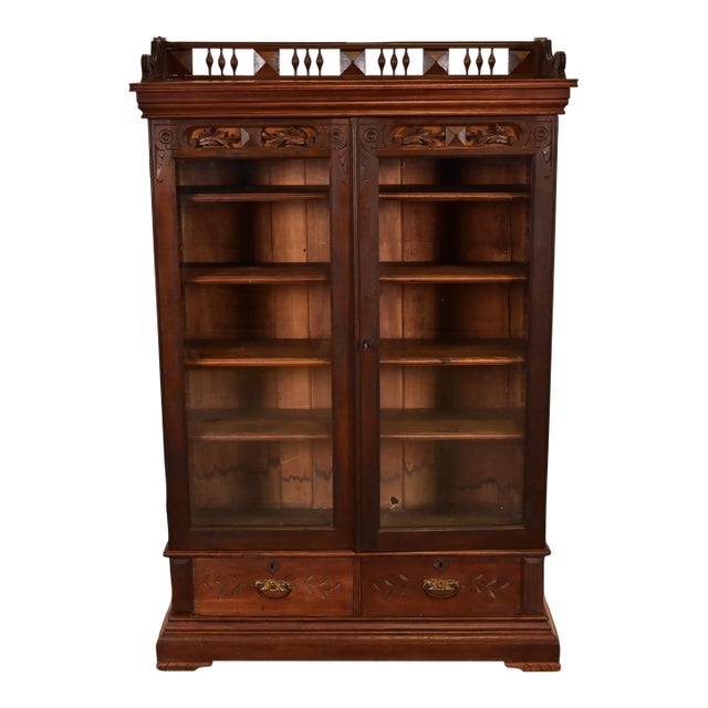 Herter Brothers Style Antique Eastlake Victorian Carved Walnut Bookcase, Circa 1880s For Sale