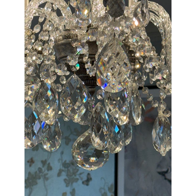 This is a Schonbeck Isabel chandelier and two matching sconces that have hung in a dining room for 15 years and are in...
