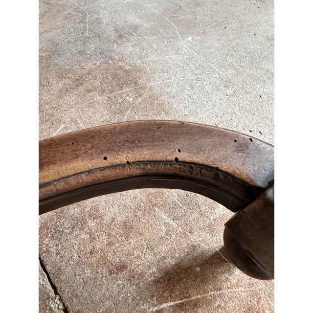 A magnificent Antique French Henri II dining chair, hand-carved from solid walnut with richly detailed lion head armrests...