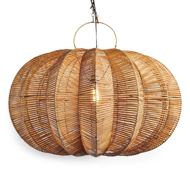 Handmade split stain rattan pumpkin lantern. Overall measurements are 40" x 40" x 25" with 5" top ring. Each lantern may...
