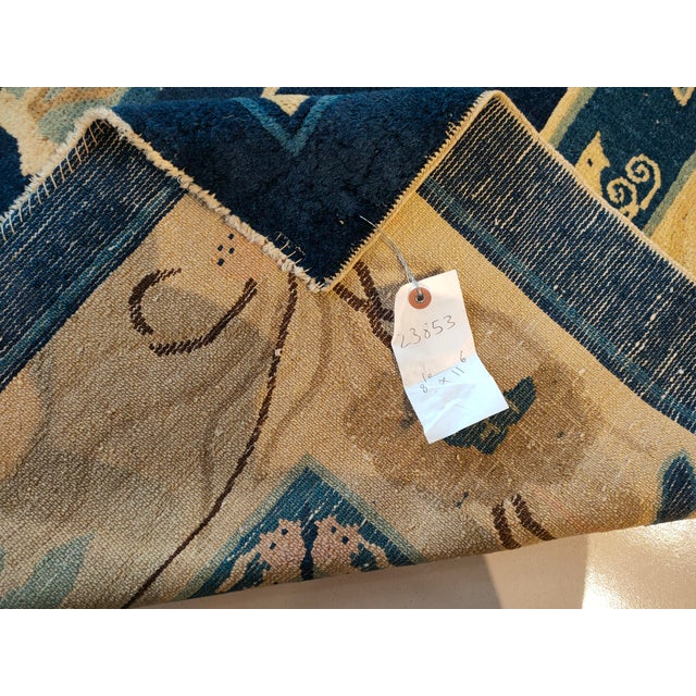 Antique Peking Room Size Wool Beige, Navy Rug, Circa Date: 1880s. This exceptional late Qing Dynasty weaving presents a...