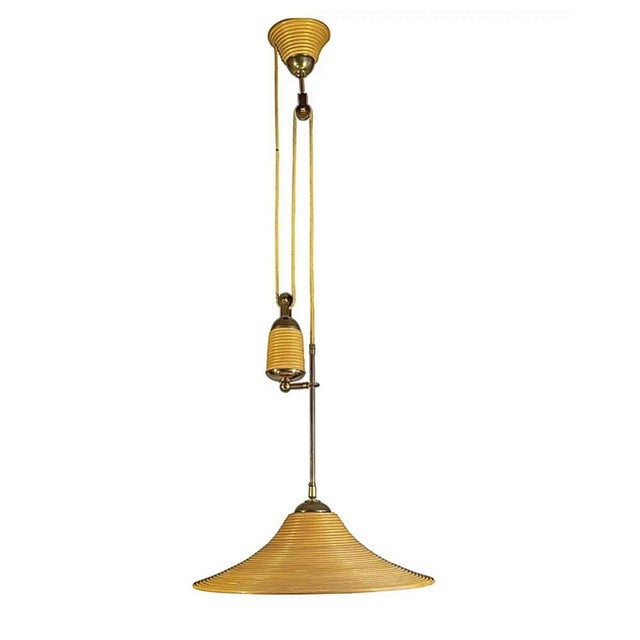 Stylish Mid-Century made pendant light, adjustable height. This rare 1970s light fixture is ideal for bringing good style...