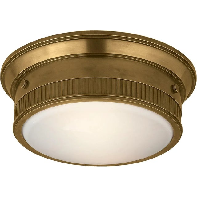 Calliope Marine Flush Mount in Hand-Rubbed Antique Brass Designer: Thomas O'Brien Mounting: Flush Shade Detail: White...