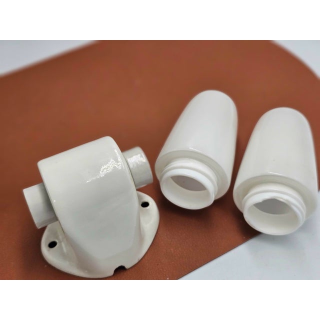 Wilhelm Wagenfeld porcelain wall lamp from 1958, dimensions: height 8 cm, width 25.5 cm, depth 9.5 cm. European Plug (up...