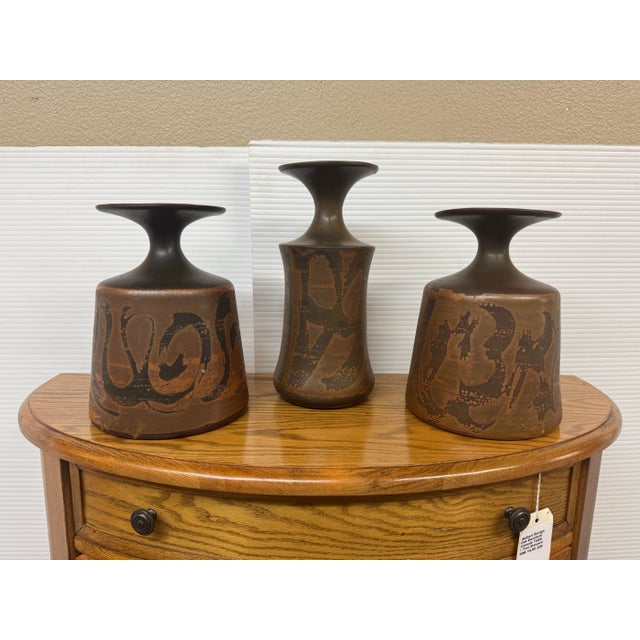 Design Plus Gallery presents a Set of Three Vases from Designs West Stoneware. The vases are from the mid 1960s and are...