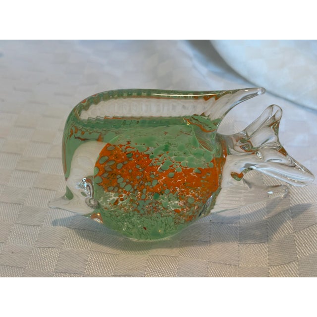 Four Murano Glass fish in various sizes. While all the fish are green, one fish is much larger than the other 3. Each fish...