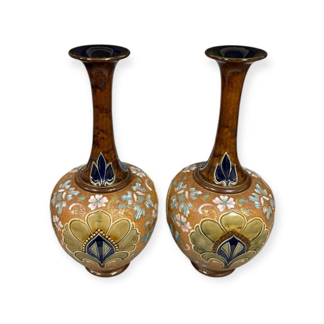 A stunning pair of antique Royal Doulton Slater’s Patent vases, dating to around 1900, featuring the distinctive textured...