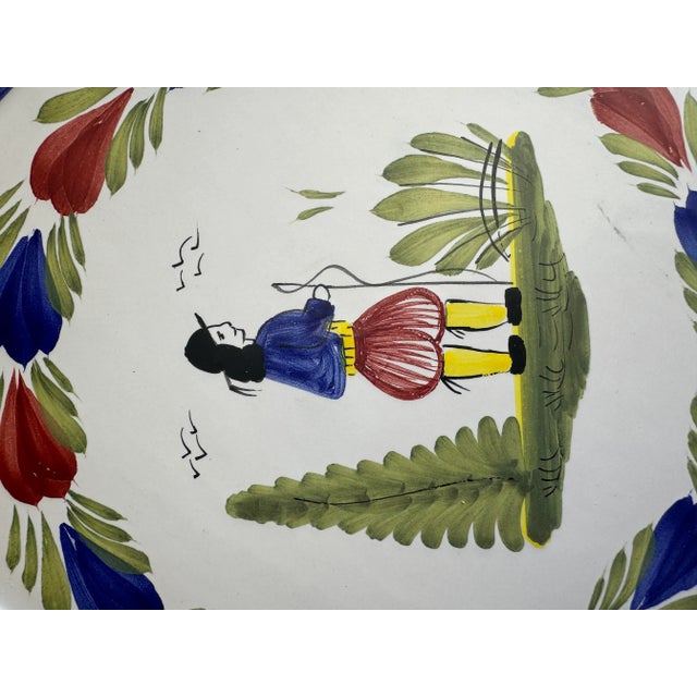 This plate depicts the male figure. It would be a good piece to hang on a wall or as a serving piece.