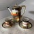 A vintage three-piece porcelain chocolate or demitasse coffee service hand-painted by Noritake in Japan. The set includes...
