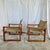 Handsome pair of safari chairs with tan canvas upholstery and solid teak frames doweled at back joints for easy fold-down....