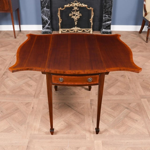 This beautiful Mahogany Pembroke Table from Niagara Furniture will be recognizable to anyone familiar with fine antiques....