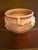 The Roseville Art Pottery Apple Blossom Small Jardiniere Vase #300-4, made in the United States around 1948, is a...
