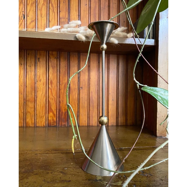 Sculptural metal candle holder that takes design cues from the Postmodernism stylings of the Memphis Milano Group, circa...