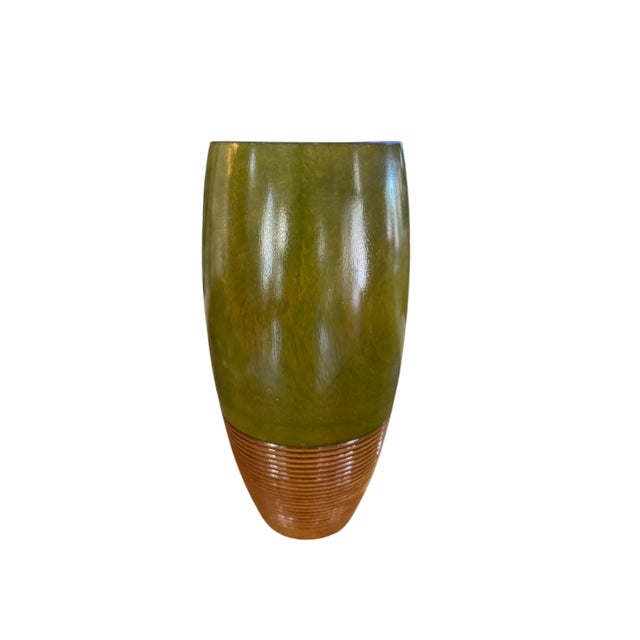 This striking vintage hand-turned wood vase showcases a sophisticated blend of natural craftsmanship and modern design....