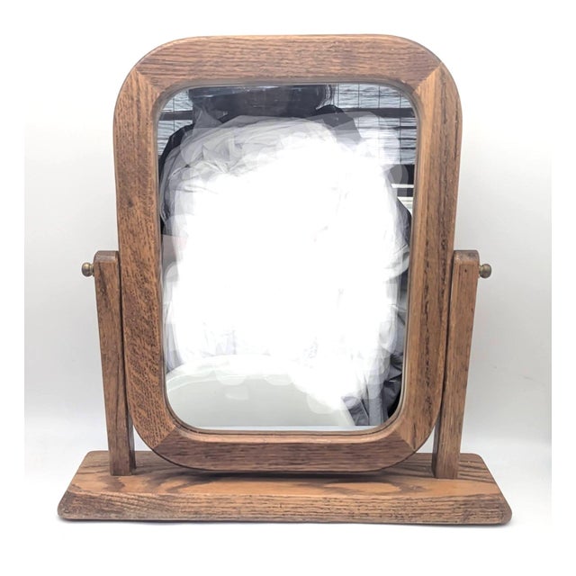 Offered is a 1970s Goodwood brand cheval / vanity / shaving Oak wood framed swivel mirror that has bull-nosed corners. It...