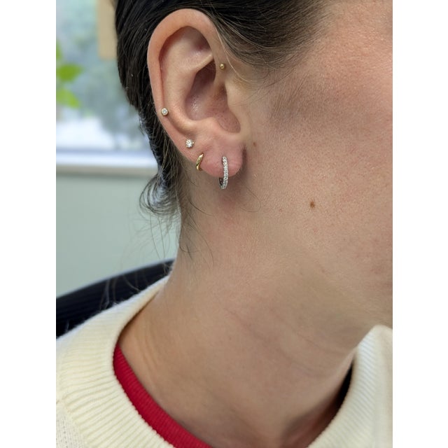 Like a secret shimmer whispered in white gold, these dainty diamond hoops bring natural brilliance to every moment....