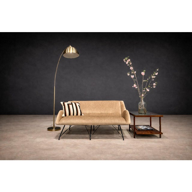 Designed by Carlo Hauner and manufactured by Forma Móveis in 1955, the Concha loveseat stands as an emblematic example of...